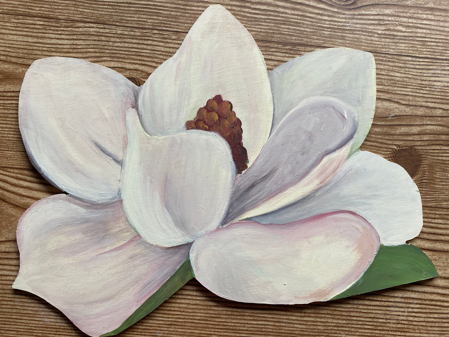 Decorative paper flower on a wooden surface